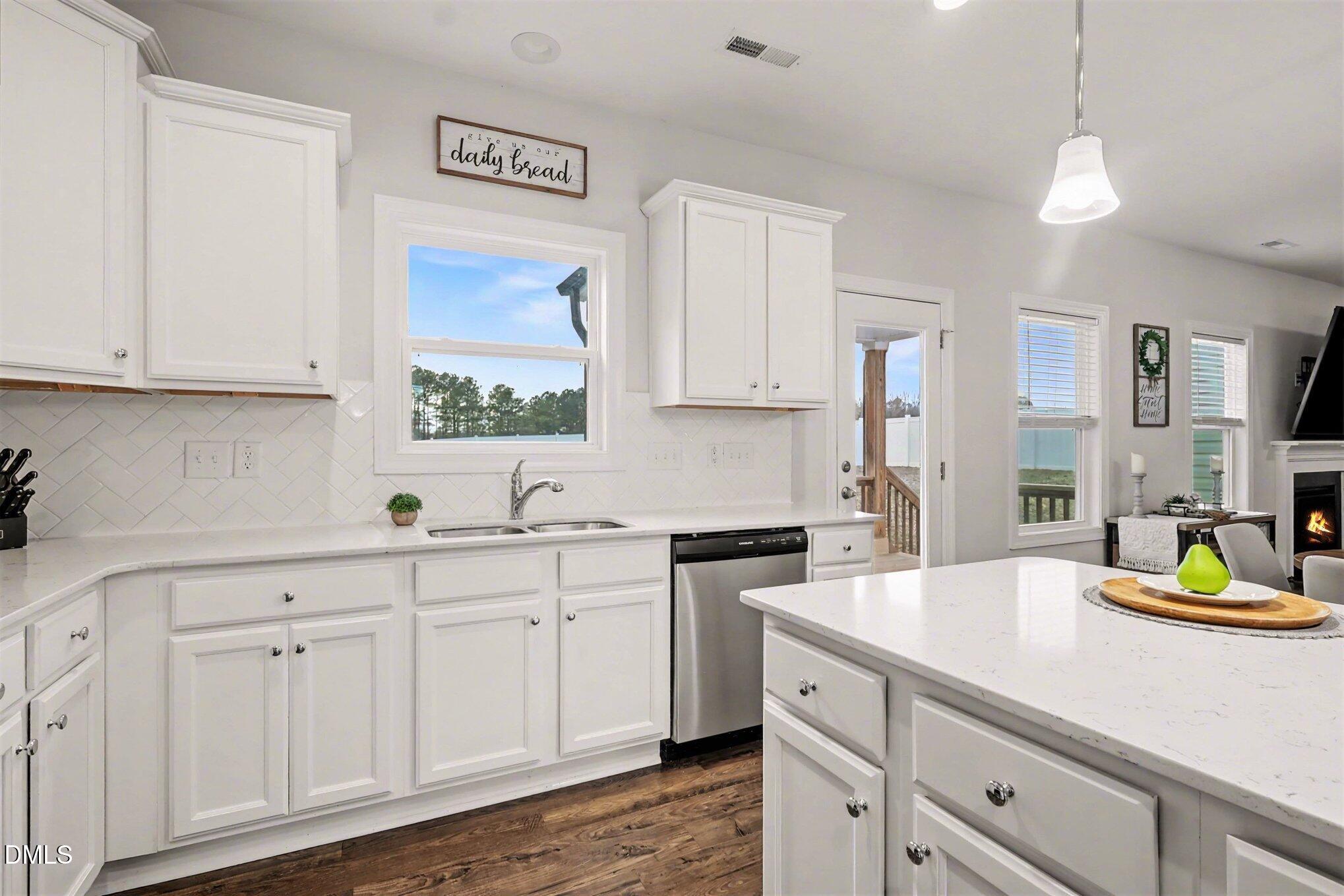 190 Stephens Timberline View Clayton, NC 27520 - Photo 20 of 42 a kitchen with stainless steel appliances granite countertop a sink a stove and cabinets