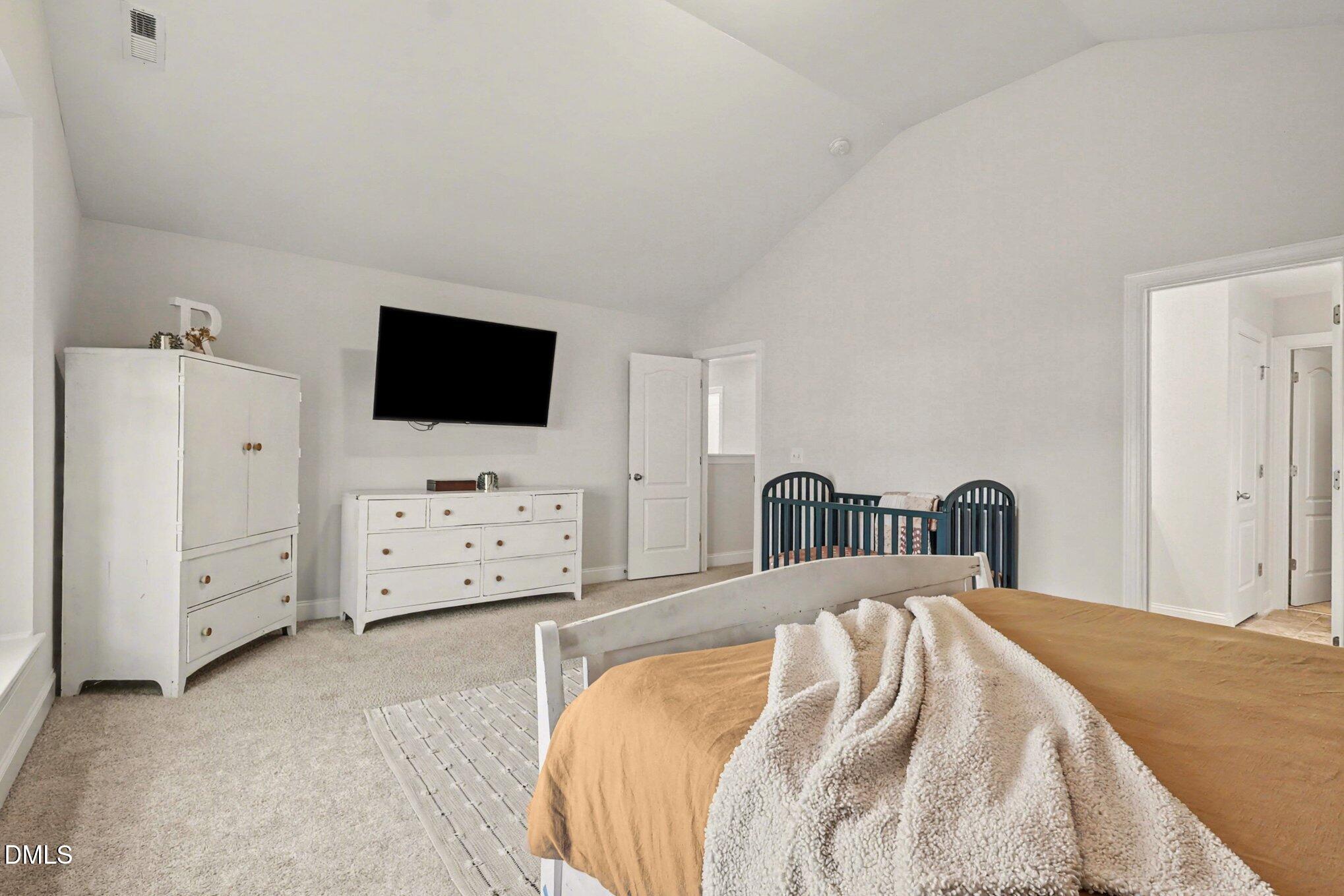 190 Stephens Timberline View Clayton, NC 27520 - Photo 25 of 42 a bed room with a bed and television