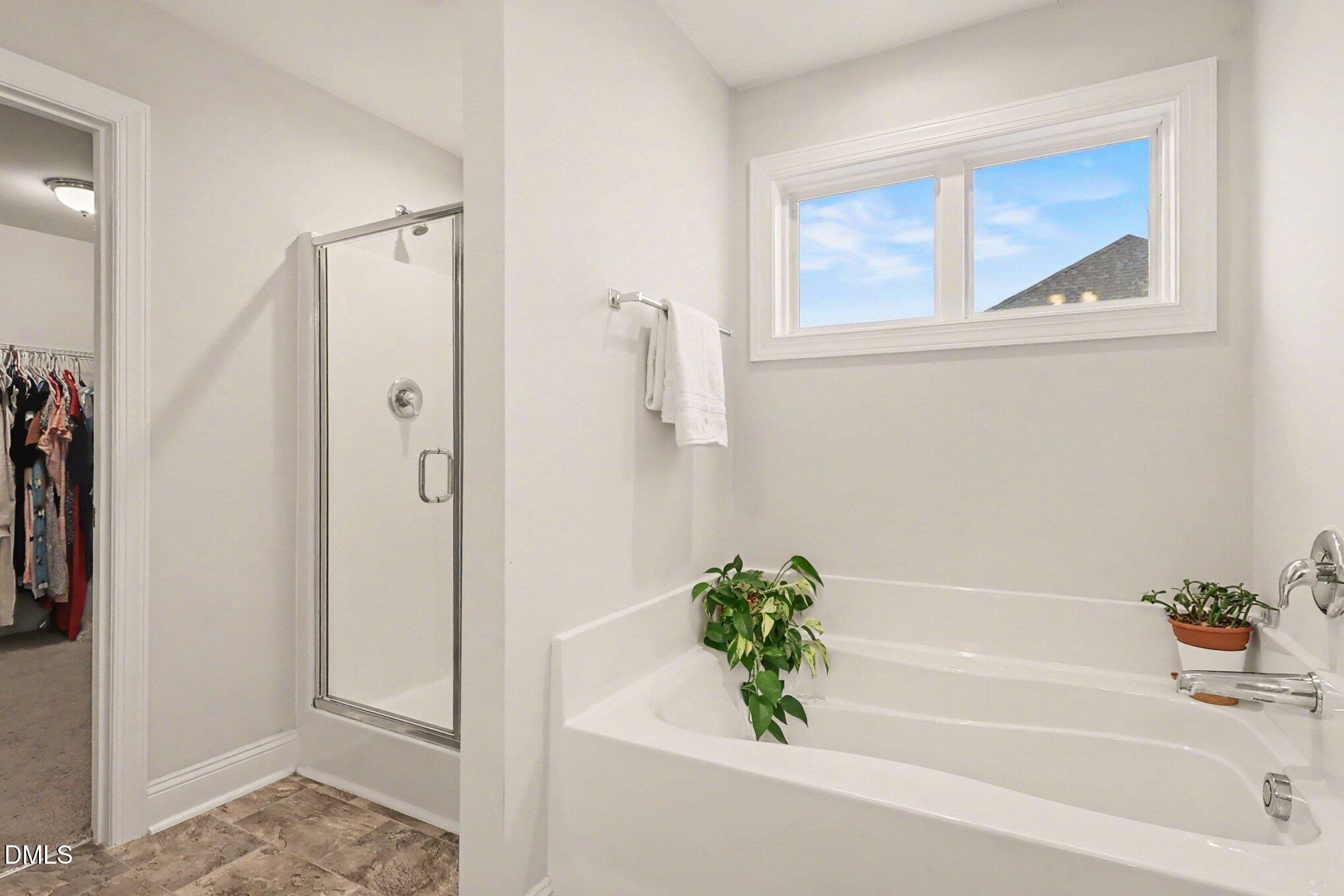 190 Stephens Timberline View Clayton, NC 27520 - Photo 26 of 42 a bathroom with a bathtub and a shower