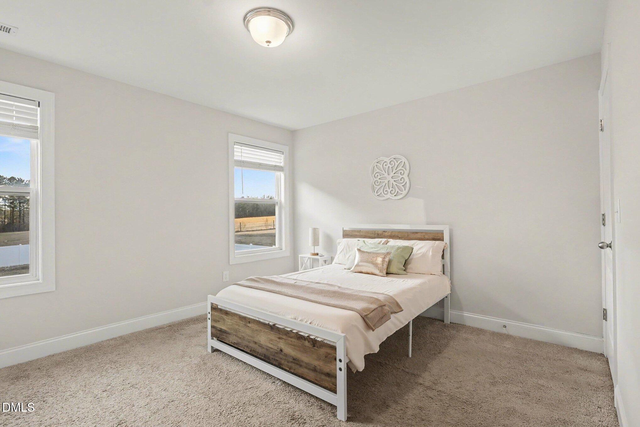 190 Stephens Timberline View Clayton, NC 27520 - Photo 31 of 42 a bedroom with a bed and window