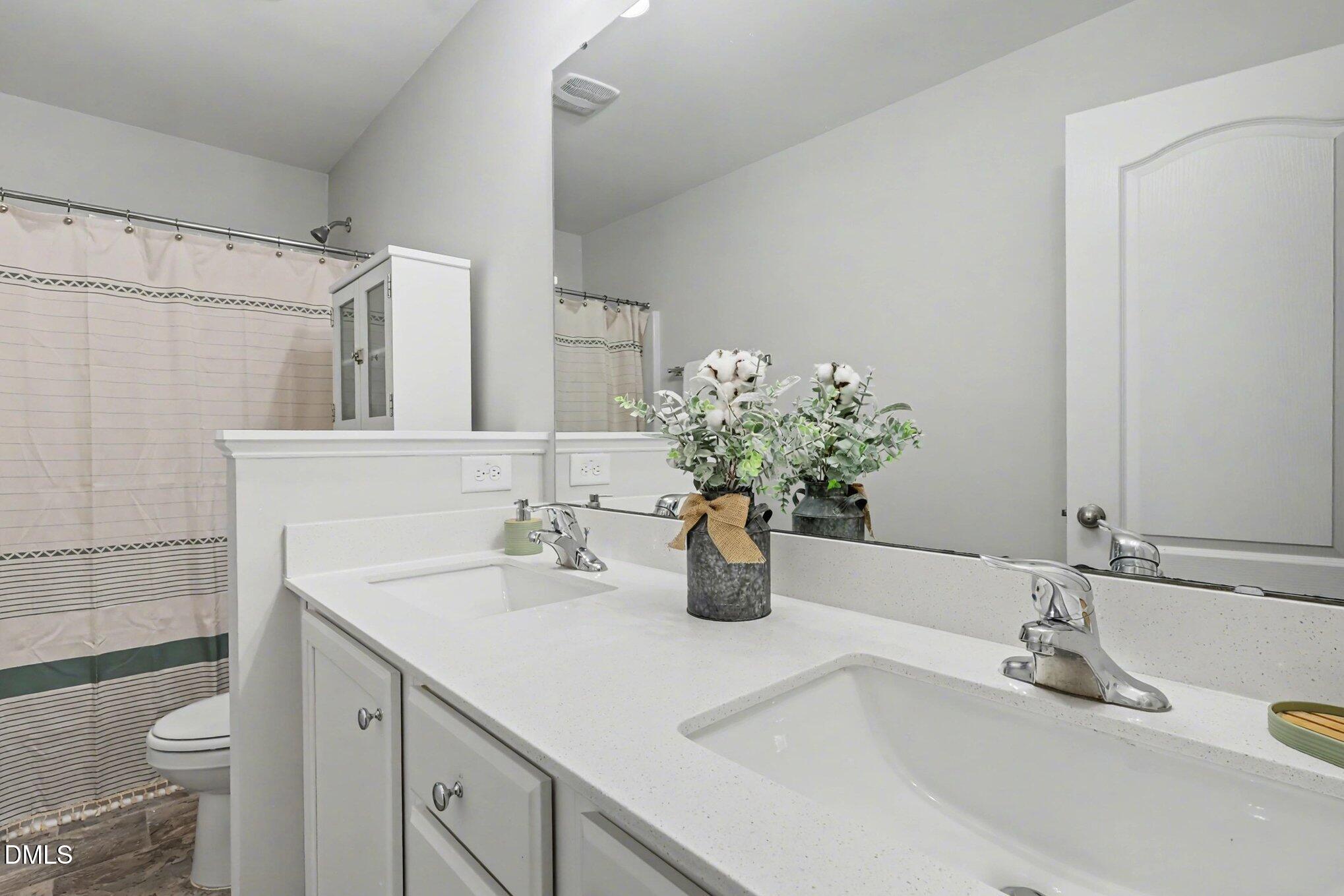 190 Stephens Timberline View Clayton, NC 27520 - Photo 34 of 42 a bathroom with a sink a toilet and mirror