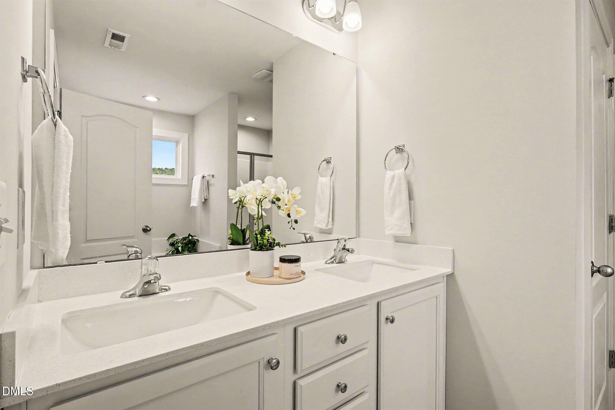 190 Stephens Timberline View Clayton, NC 27520 - Photo 35 of 42 a bathroom with a sink and a mirror