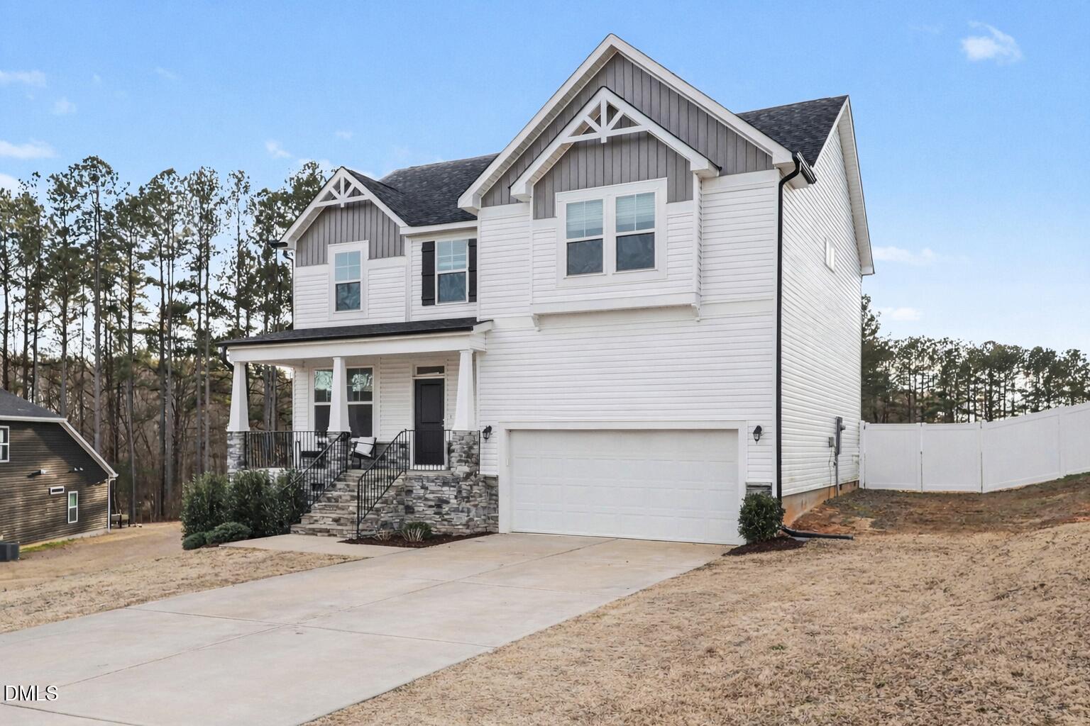 190 Stephens Timberline View Clayton, NC 27520 - Photo 3 of 42 a front view of a house with a yard and garage