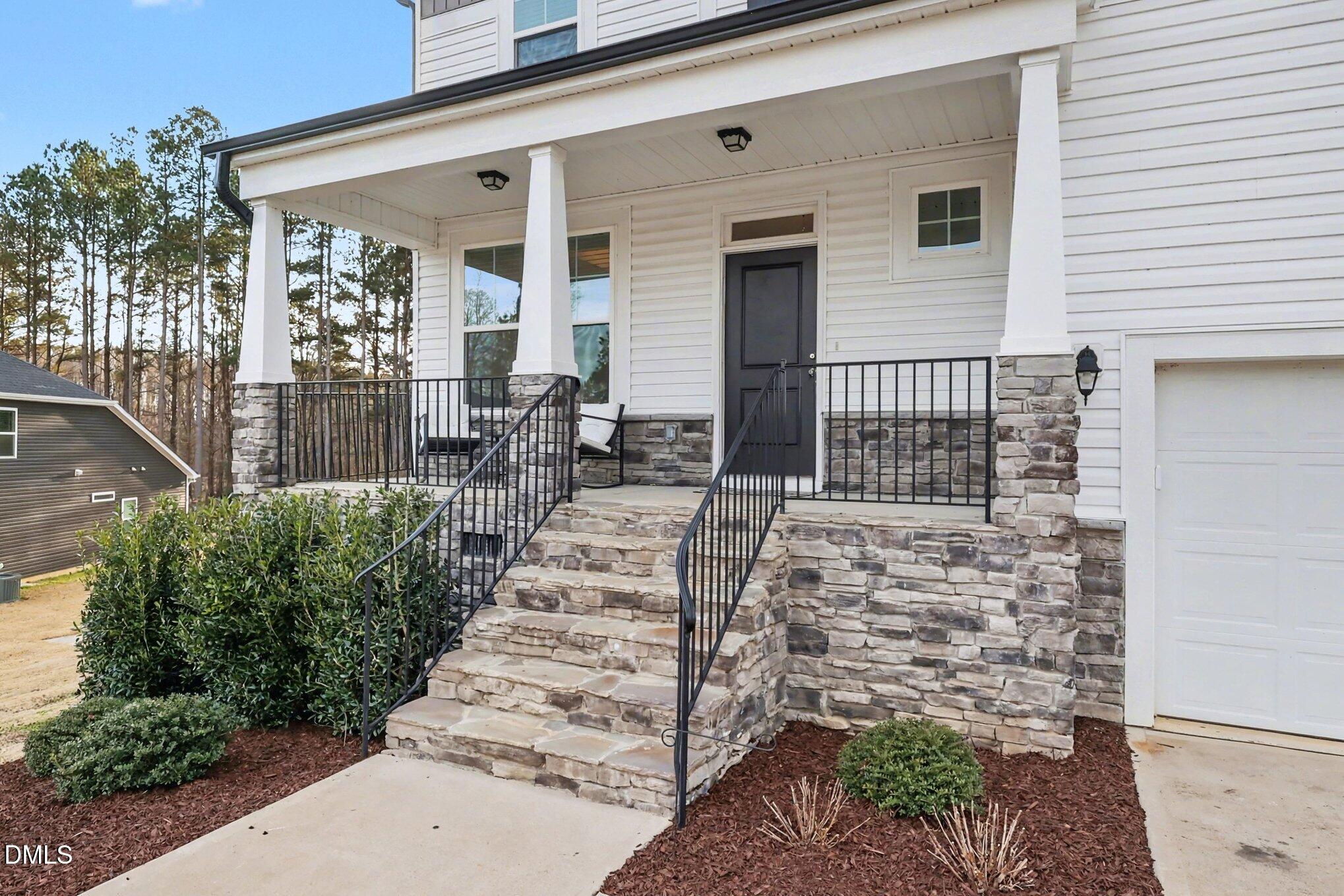 190 Stephens Timberline View Clayton, NC 27520 - Photo 4 of 42 a front view of a house with outdoor seating