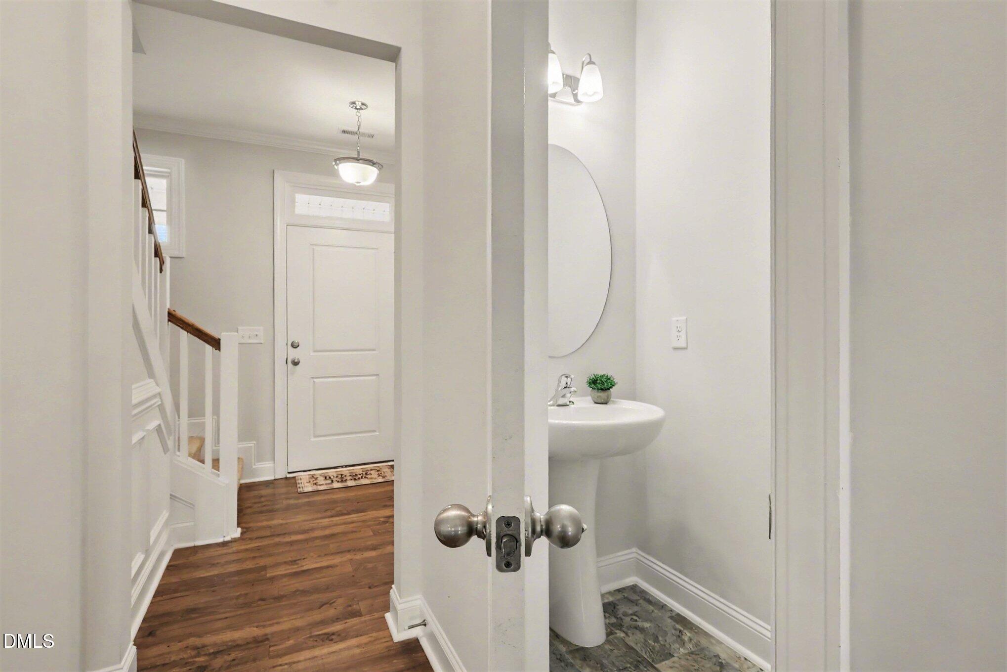 190 Stephens Timberline View Clayton, NC 27520 - Photo 5 of 42 a view of a hallway with wooden floor and staircase