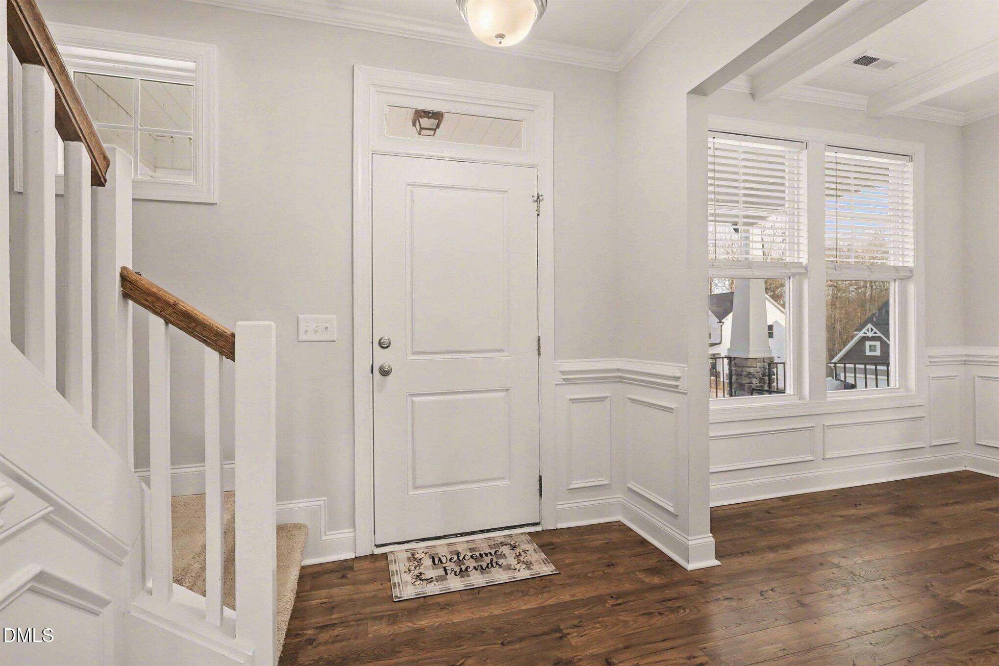 190 Stephens Timberline View Clayton, NC 27520 - Photo 7 of 42 an entryway space view with wooden floor and staircase