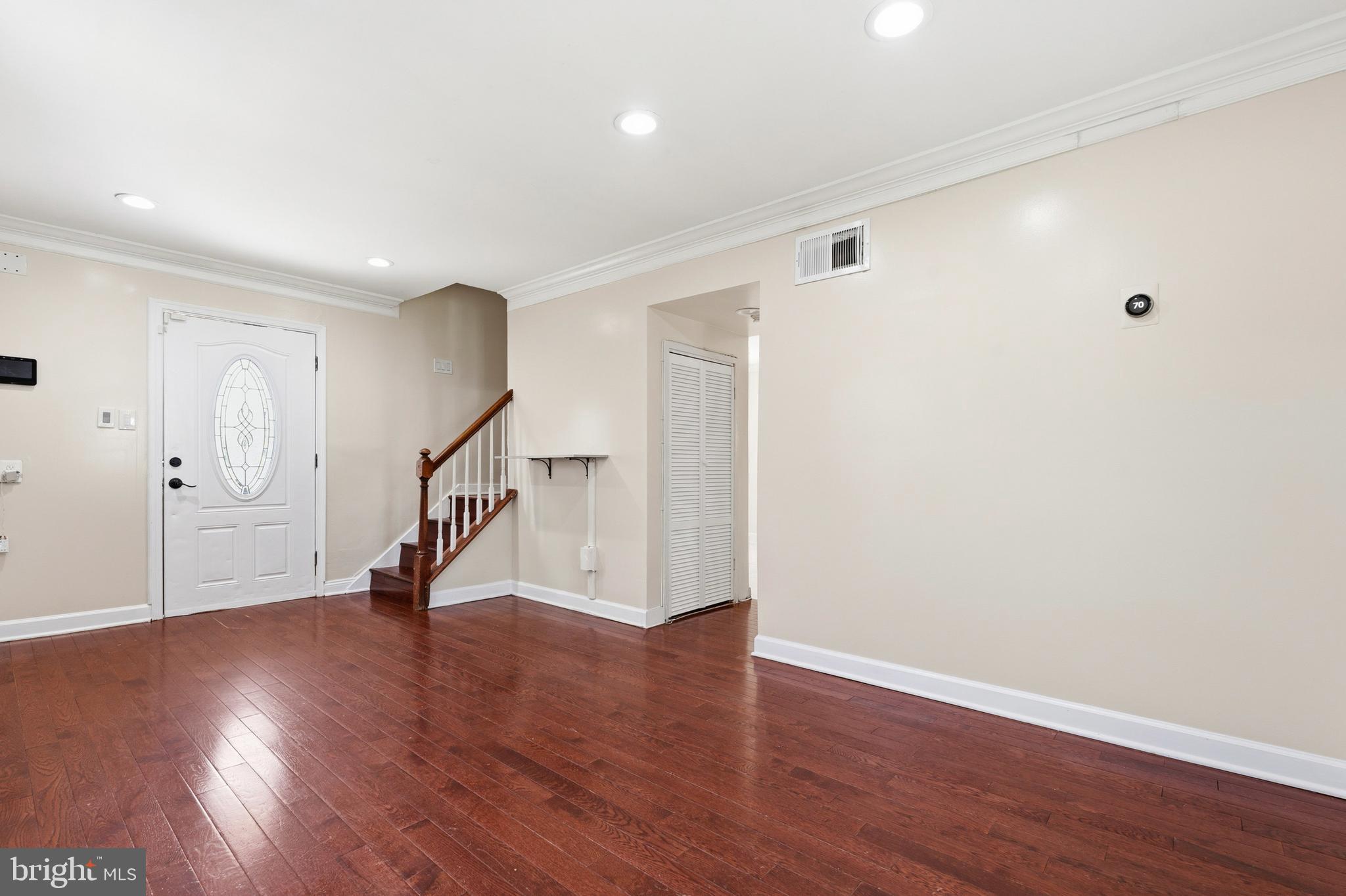 7204 East Inwood Street Landover, MD 20785 - Photo 6 of 24 a view of an empty room with wooden floor