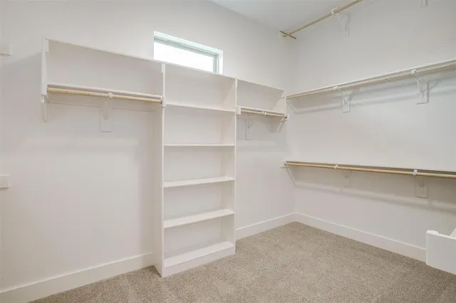 a view of an empty walk in closet
