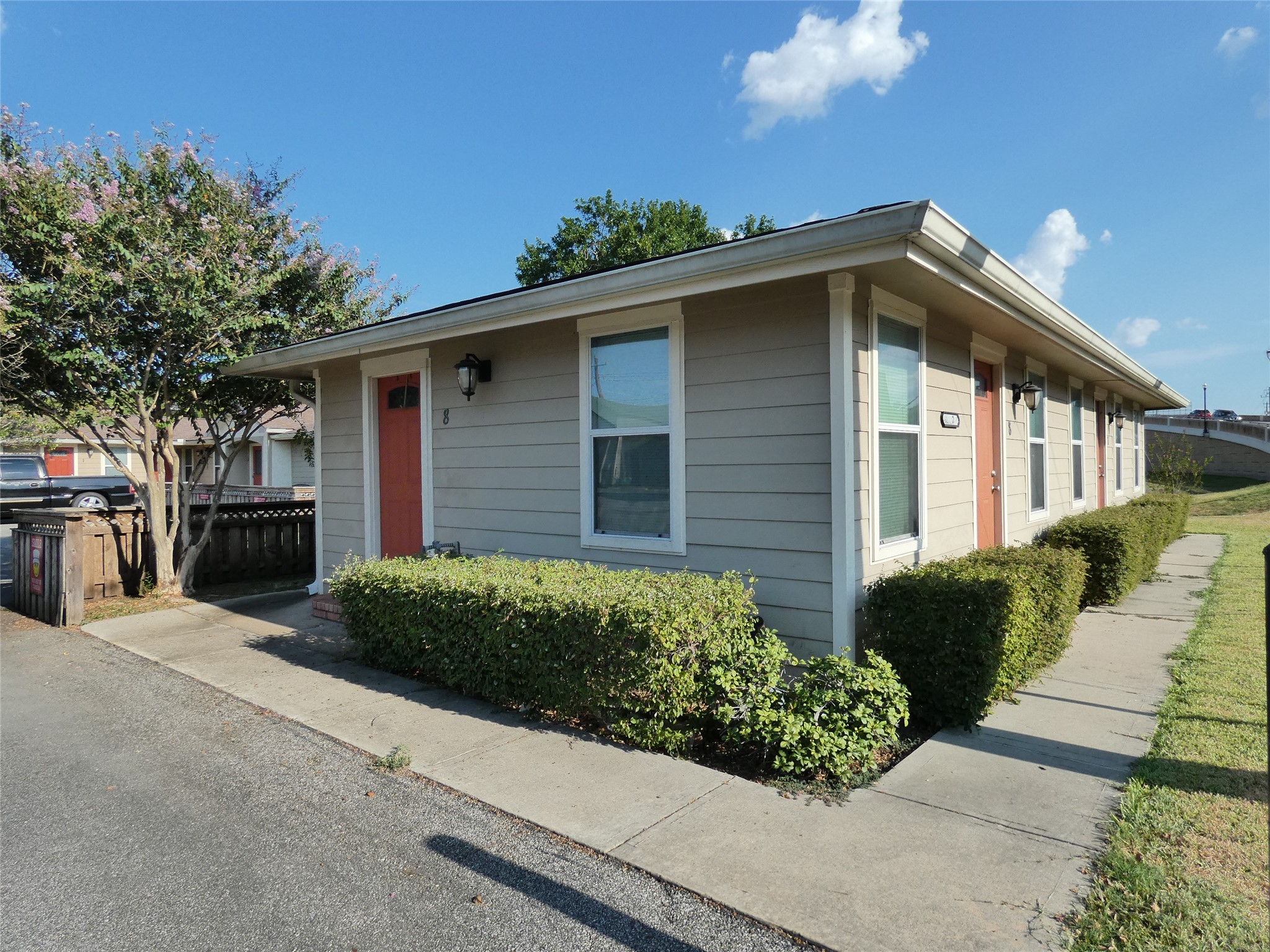 507 Houston Street, Unit 8 Rosenberg, TX 77471 - Photo 1 of 21 a front view of a house with a yard