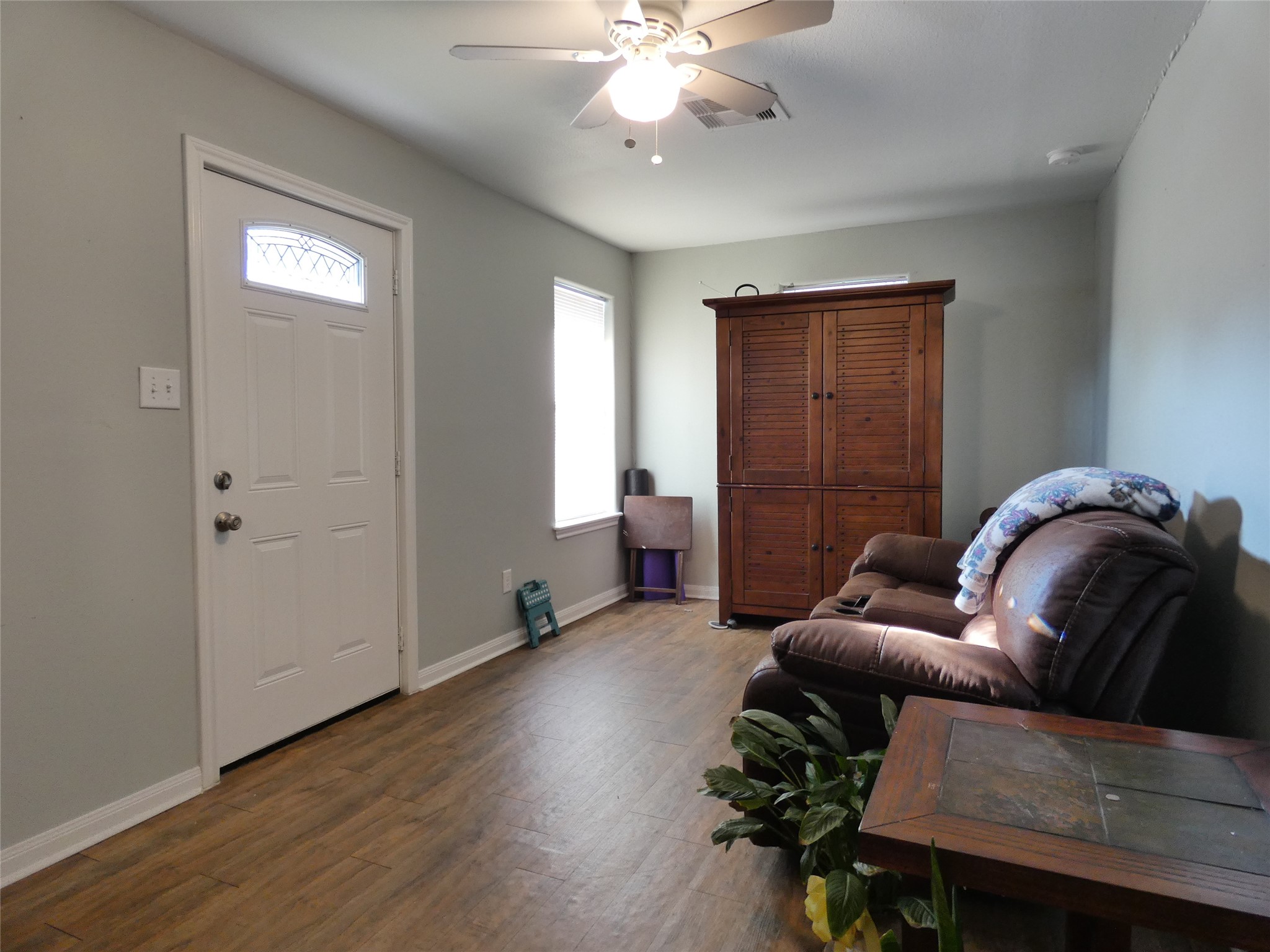 507 Houston Street, Unit 8 Rosenberg, TX 77471 - Photo 4 of 21 a living room with furniture and wooden floor