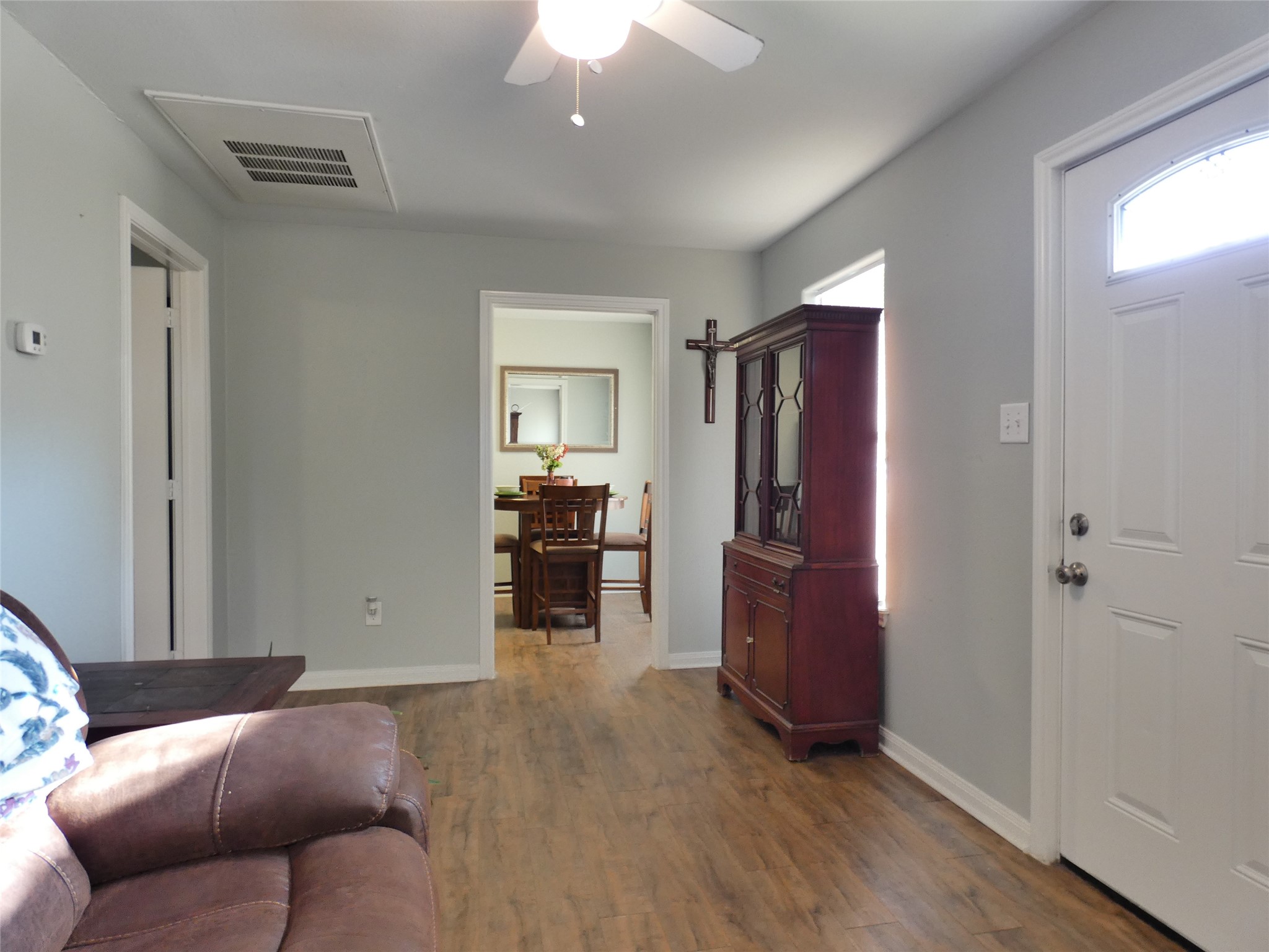 507 Houston Street, Unit 8 Rosenberg, TX 77471 - Photo 5 of 21 a living room with furniture and a flat screen tv
