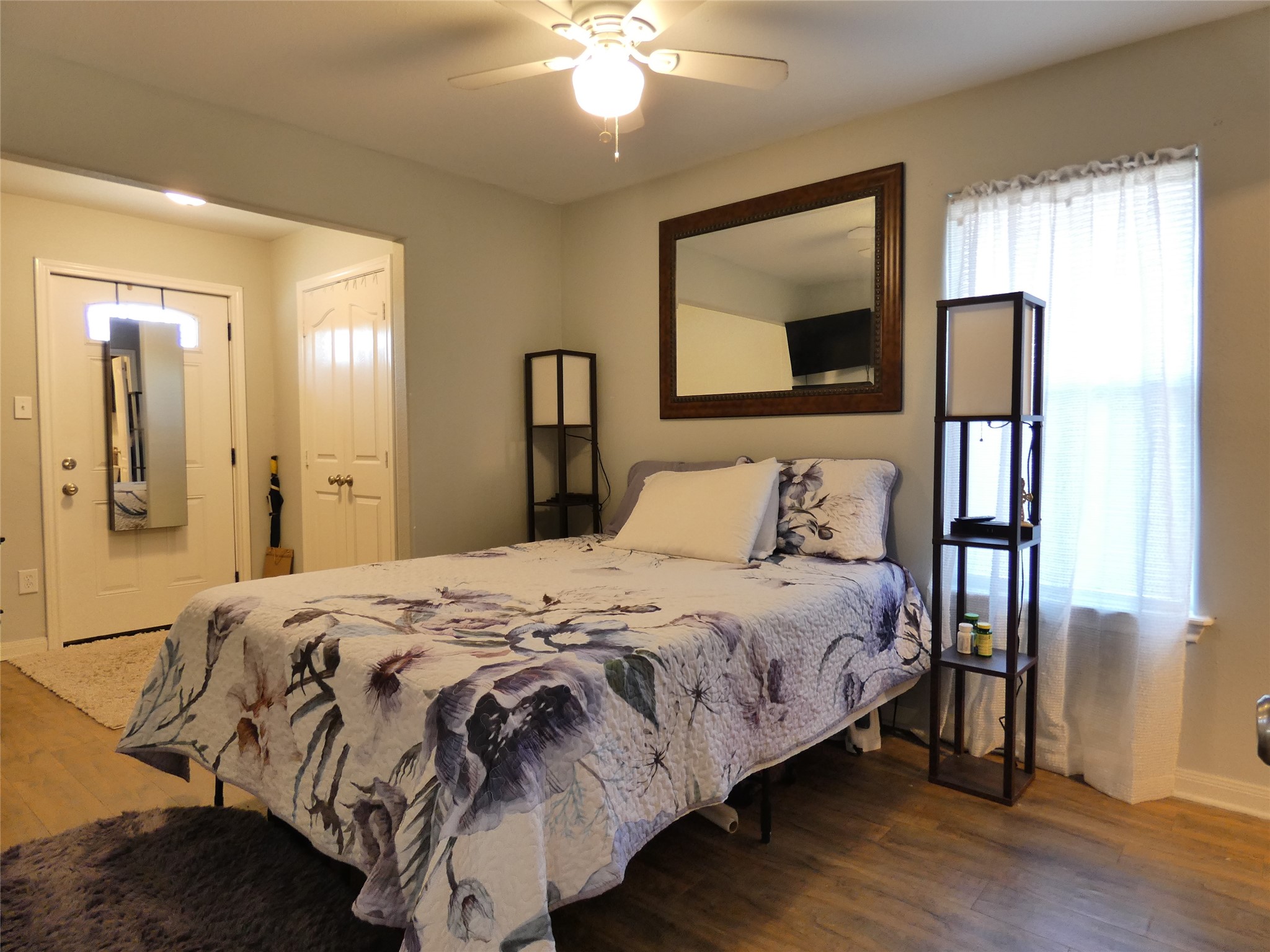 507 Houston Street, Unit 8 Rosenberg, TX 77471 - Photo 7 of 21 a bedroom with a bed and a mirror
