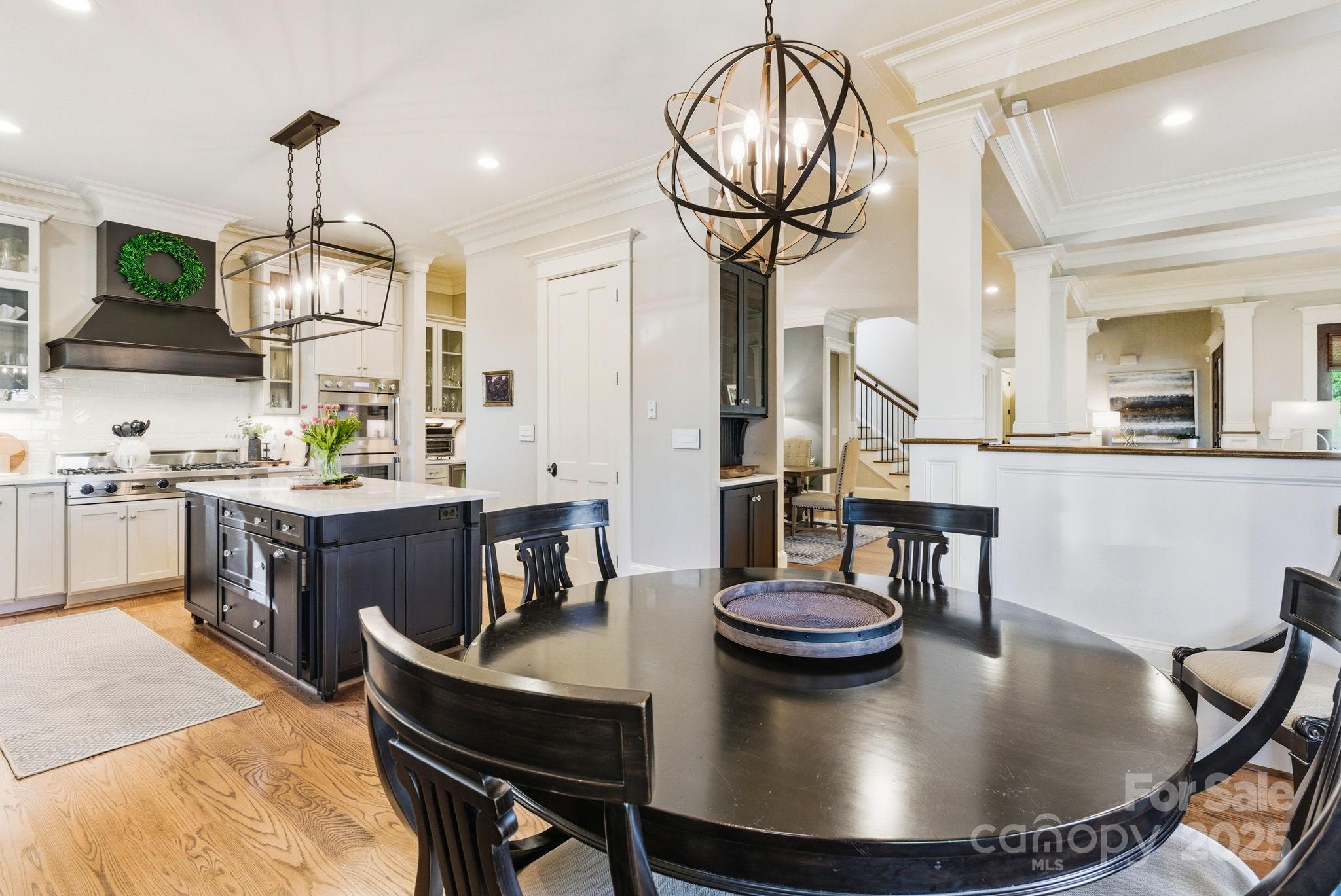 27 Veranda Lane Blythewood, SC 29016 - Photo 12 of 48 a view of a dining room with furniture a chandelier and wooden floor