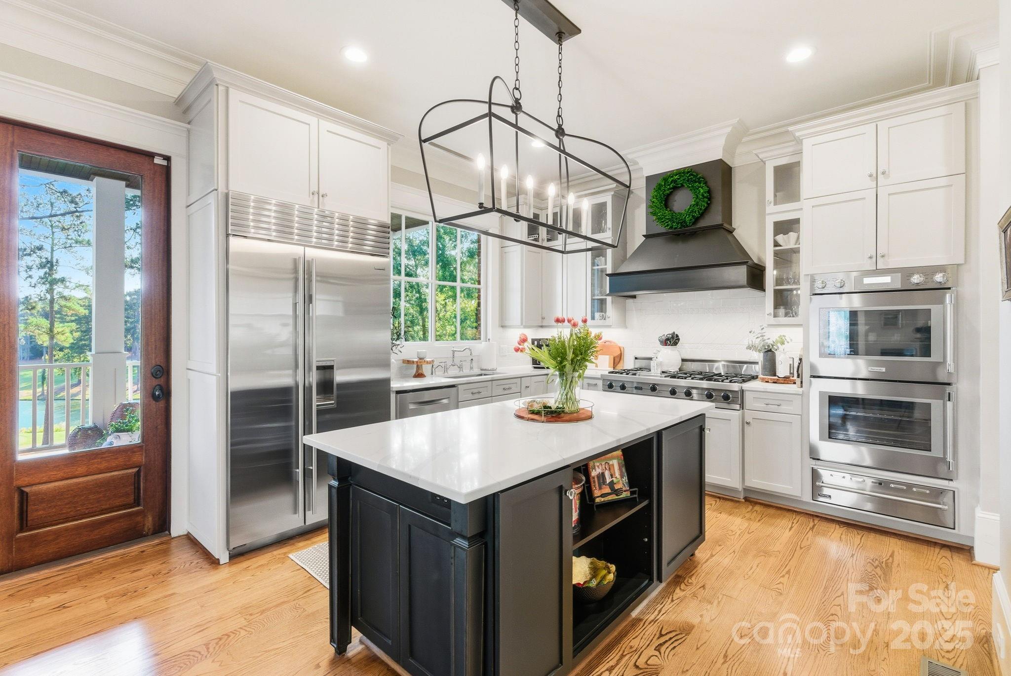 27 Veranda Lane Blythewood, SC 29016 - Photo 13 of 48 a kitchen with stainless steel appliances granite countertop a sink a stove and a refrigerator