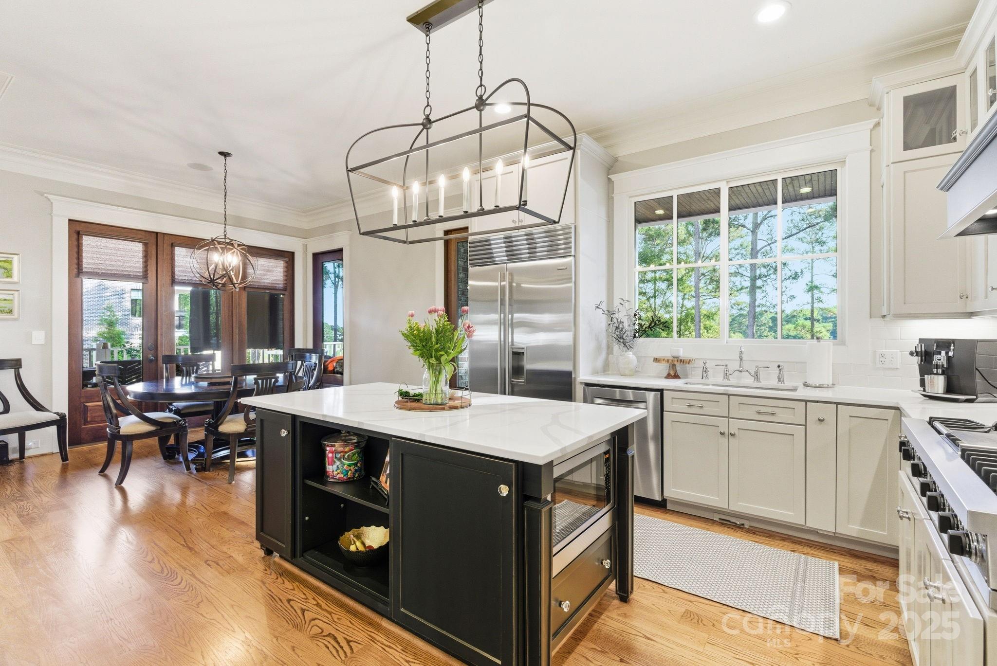 27 Veranda Lane Blythewood, SC 29016 - Photo 15 of 48 a kitchen with a sink stove and wooden cabinets