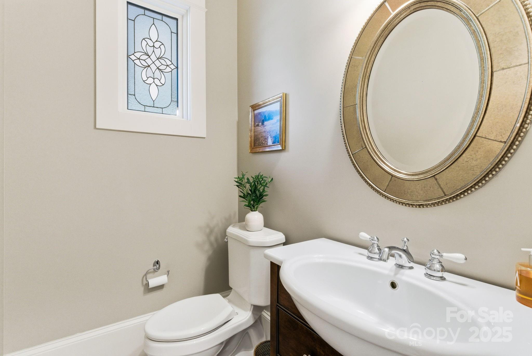 27 Veranda Lane Blythewood, SC 29016 - Photo 17 of 48 a bathroom with a sink mirror and toilet