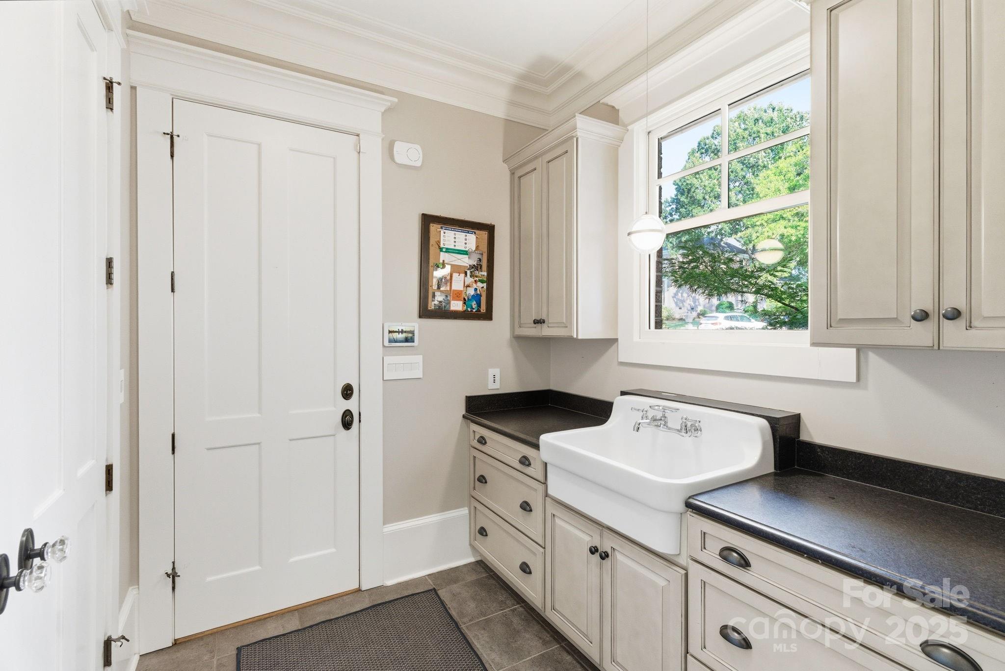 27 Veranda Lane Blythewood, SC 29016 - Photo 18 of 48 a kitchen with white cabinets and window
