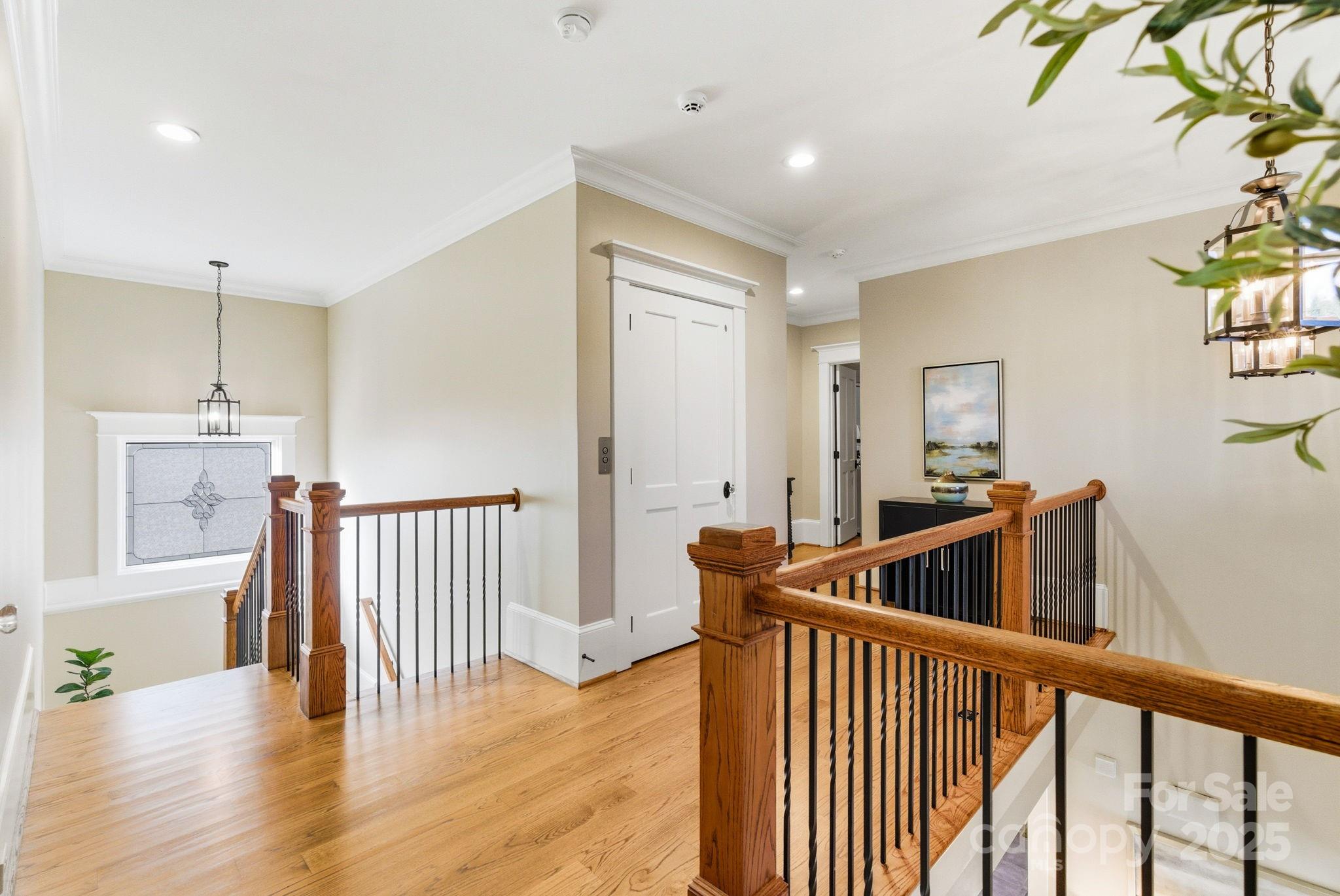 27 Veranda Lane Blythewood, SC 29016 - Photo 21 of 48 a view of a hallway with dining room and wooden floor