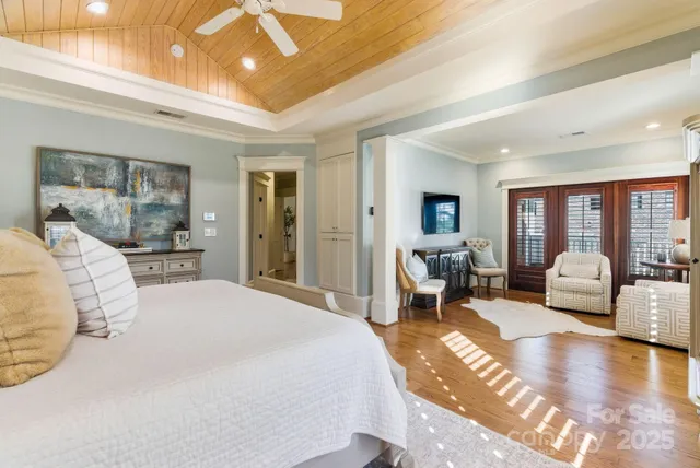 a spacious bathroom with a sink a mirror and a shower