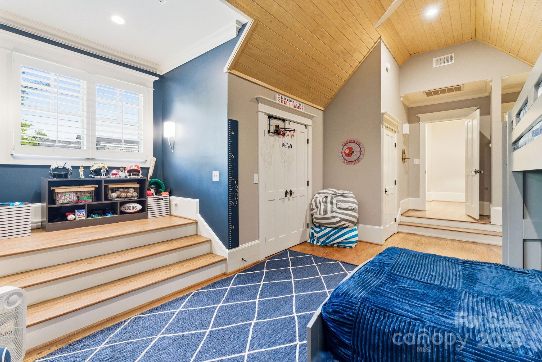 27 Veranda Lane Blythewood, SC 29016 - Photo 29 of 48 a living room with a bed and a chandelier