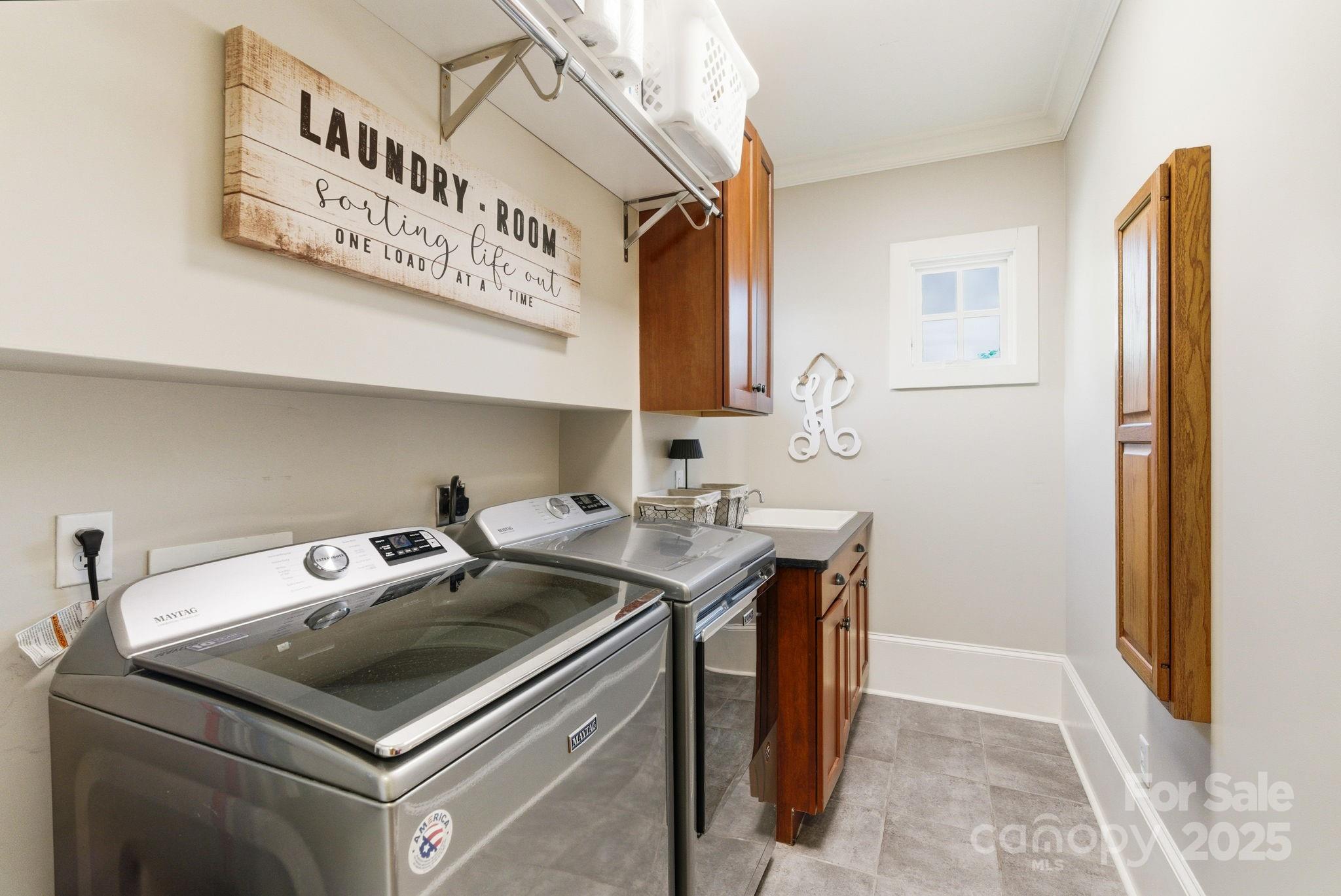 27 Veranda Lane Blythewood, SC 29016 - Photo 31 of 48 a utility room with stainless steel appliances granite countertop a sink stove and cabinets