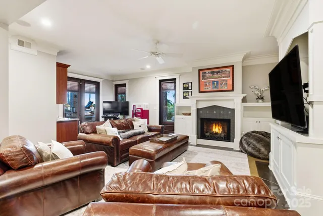a spacious bedroom with a bed couch and a window