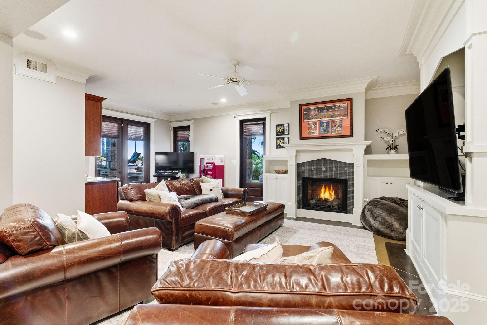 27 Veranda Lane Blythewood, SC 29016 - Photo 38 of 48 a living room with furniture a flat screen tv and a fireplace