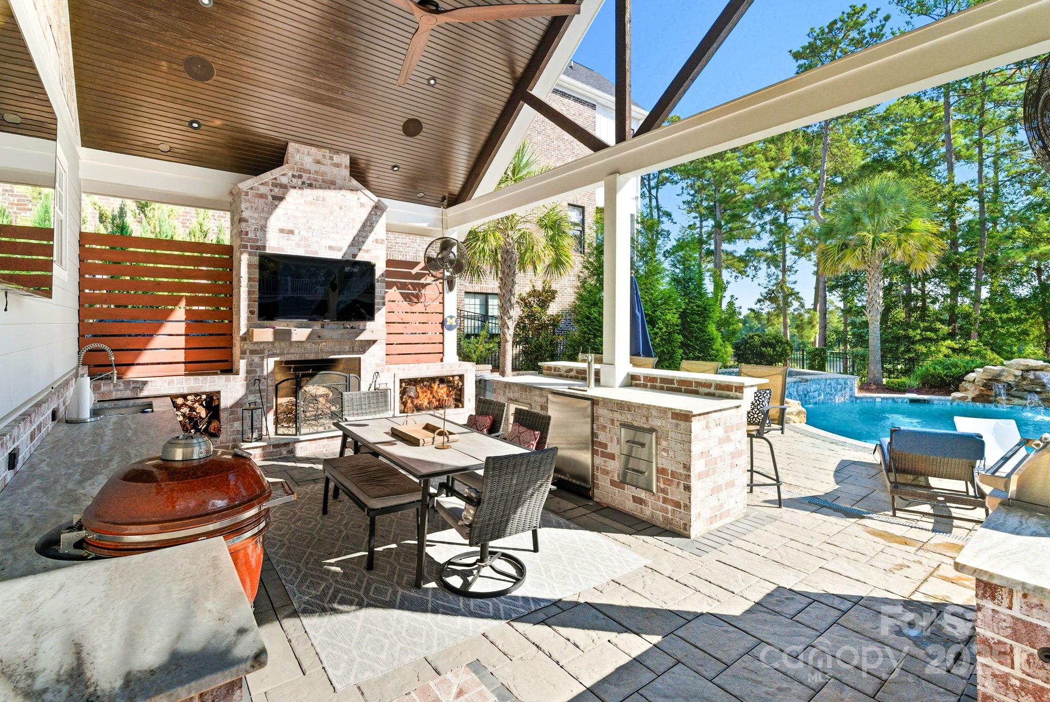 27 Veranda Lane Blythewood, SC 29016 - Photo 45 of 48 a outdoor space with chairs a flat screen tv and couches