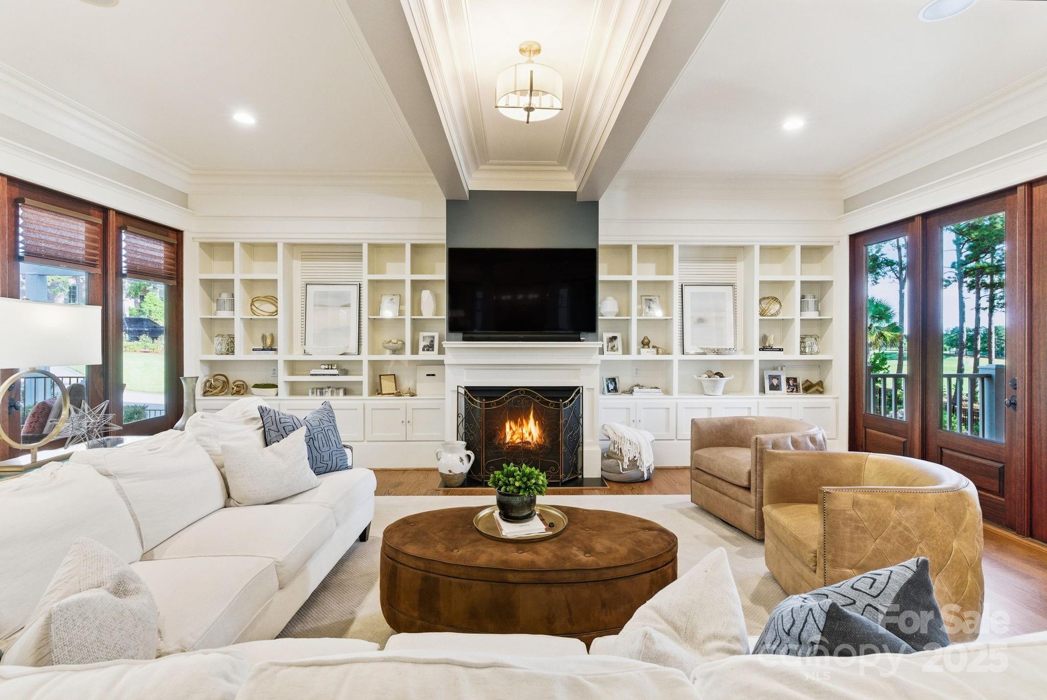 27 Veranda Lane Blythewood, SC 29016 - Photo 8 of 48 a living room with furniture a fireplace and a flat screen tv