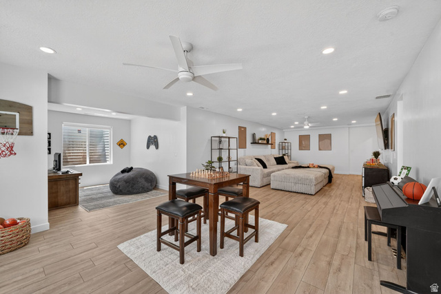 1165 West Union Bench Drive Mapleton, UT 84664 - Photo 41 of 61 Spacious open-concept room featuring wood-finish flooring, recessed lighting, and a modern ceiling fan