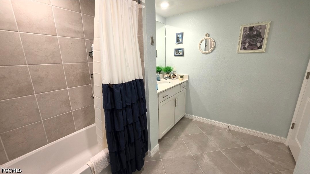14191 Poppy Fld Loop, Unit 5312 Punta Gorda, FL 33955 - Photo 32 of 41 a bathroom with a granite countertop sink a vanity and a shower