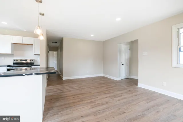 a view of kitchen with wooden floor
