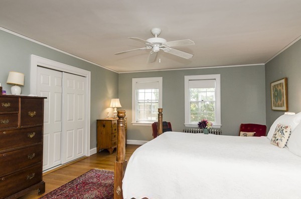 29 Lowell Road Brookline, MA 02445 - Photo 11 of 19 a spacious bedroom with a bed and wooden floor