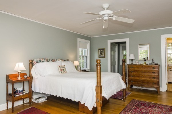 29 Lowell Road Brookline, MA 02445 - Photo 12 of 19 a bedroom with a bed and a chandelier