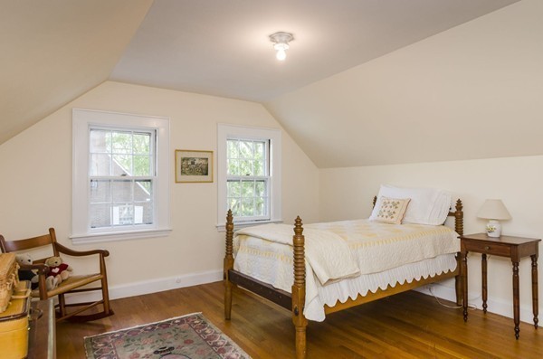 29 Lowell Road Brookline, MA 02445 - Photo 14 of 19 a bedroom with a bed and wooden floor