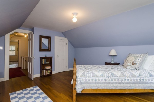 29 Lowell Road Brookline, MA 02445 - Photo 15 of 19 a bedroom with a bed and a couch