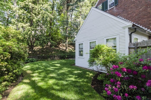 29 Lowell Road Brookline, MA 02445 - Photo 19 of 19 a view of a house with a yard and garden