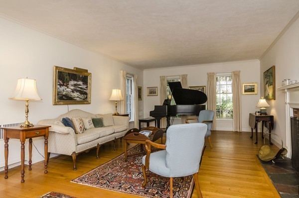 29 Lowell Road Brookline, MA 02445 - Photo 3 of 19 a living room with furniture and a lamp