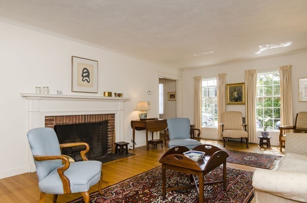 29 Lowell Road Brookline, MA 02445 - Photo 4 of 19 a living room with furniture and a fireplace
