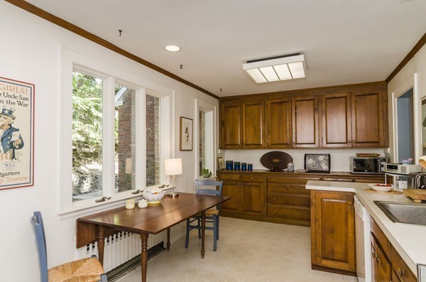29 Lowell Road Brookline, MA 02445 - Photo 5 of 19 a kitchen with stainless steel appliances granite countertop a sink a stove and a refrigerator