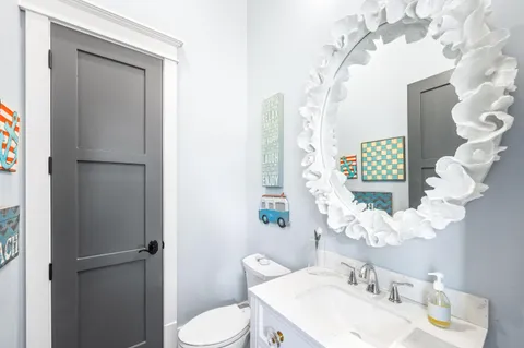 a large bedroom with a bed and a flat screen tv