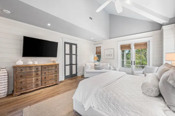 a bedroom with furniture and a window