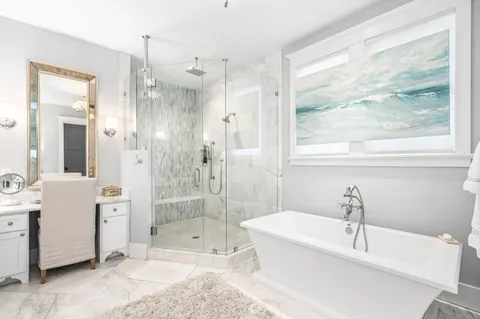 a bathroom with a bathtub and a shower