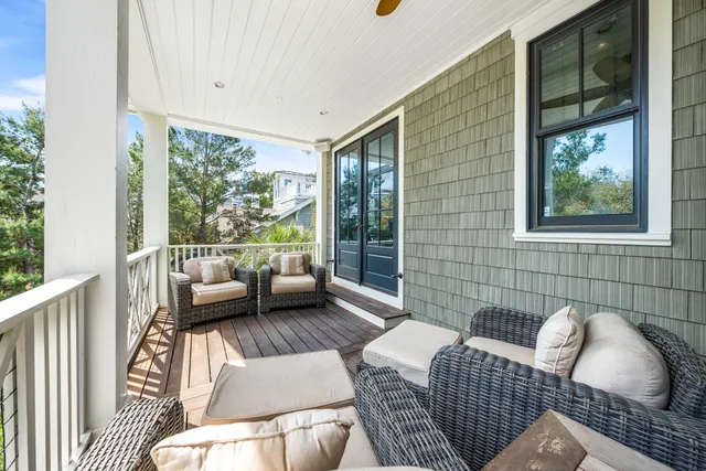 a bedroom with a large bed and a large window