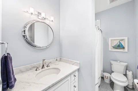 a swimming pool with yard in front of it