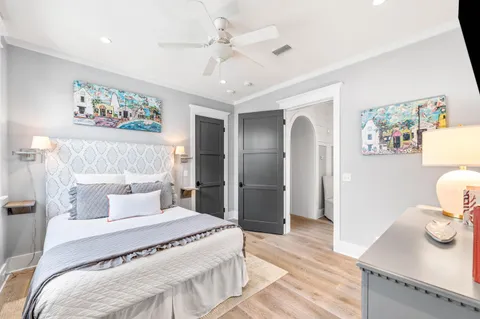 a view of a patio with couches chairs and wooden floor