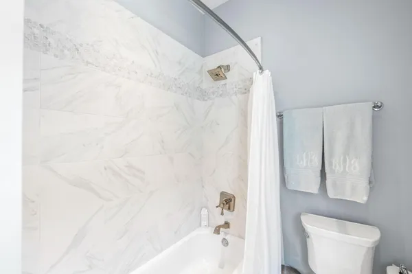 a front view of a house with basket ball court and outdoor seating