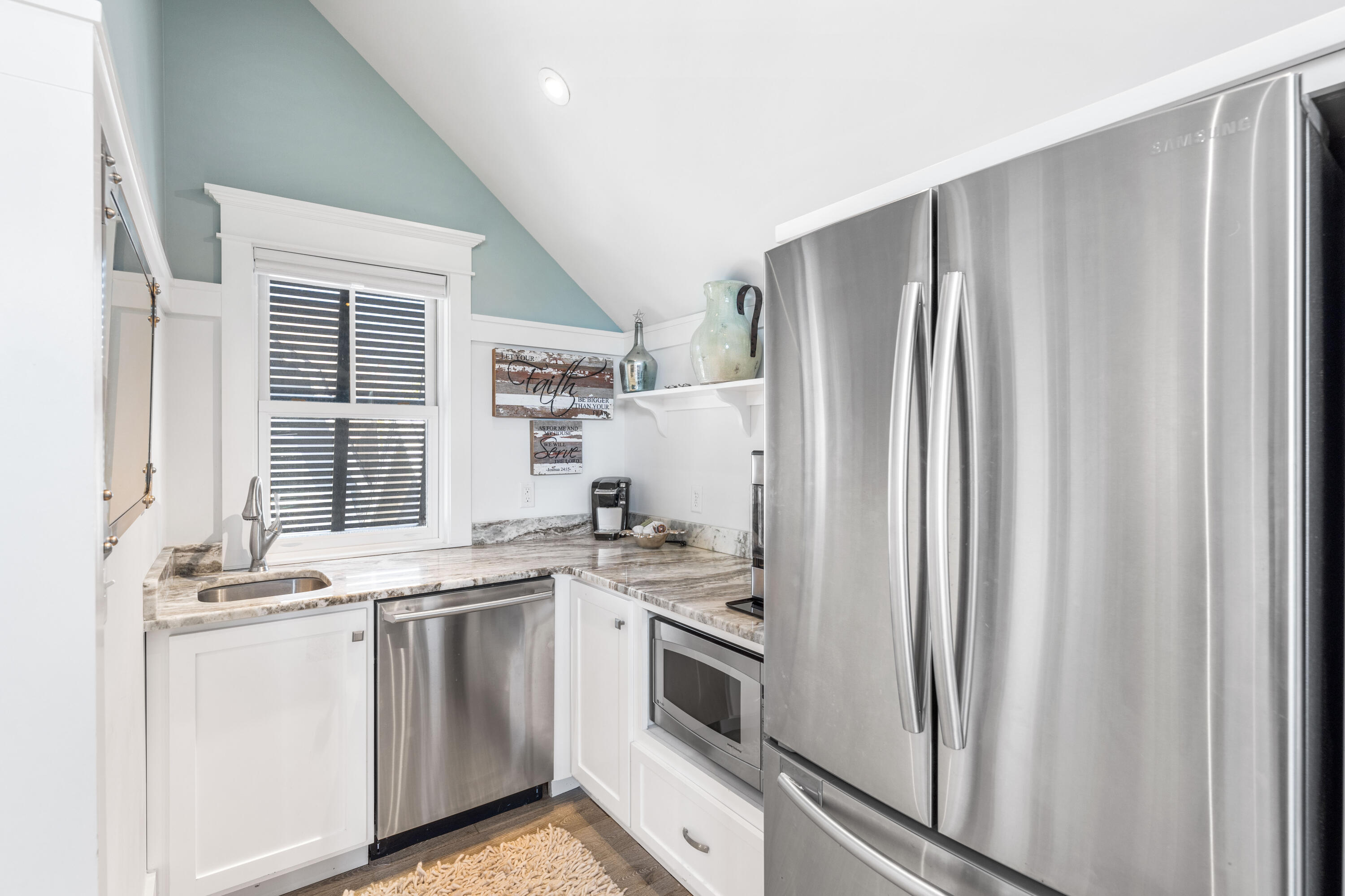 52 North Shingle Way Inlet Beach, FL 32461 - Photo 48 of 77 a kitchen with stainless steel appliances a refrigerator sink and cabinets