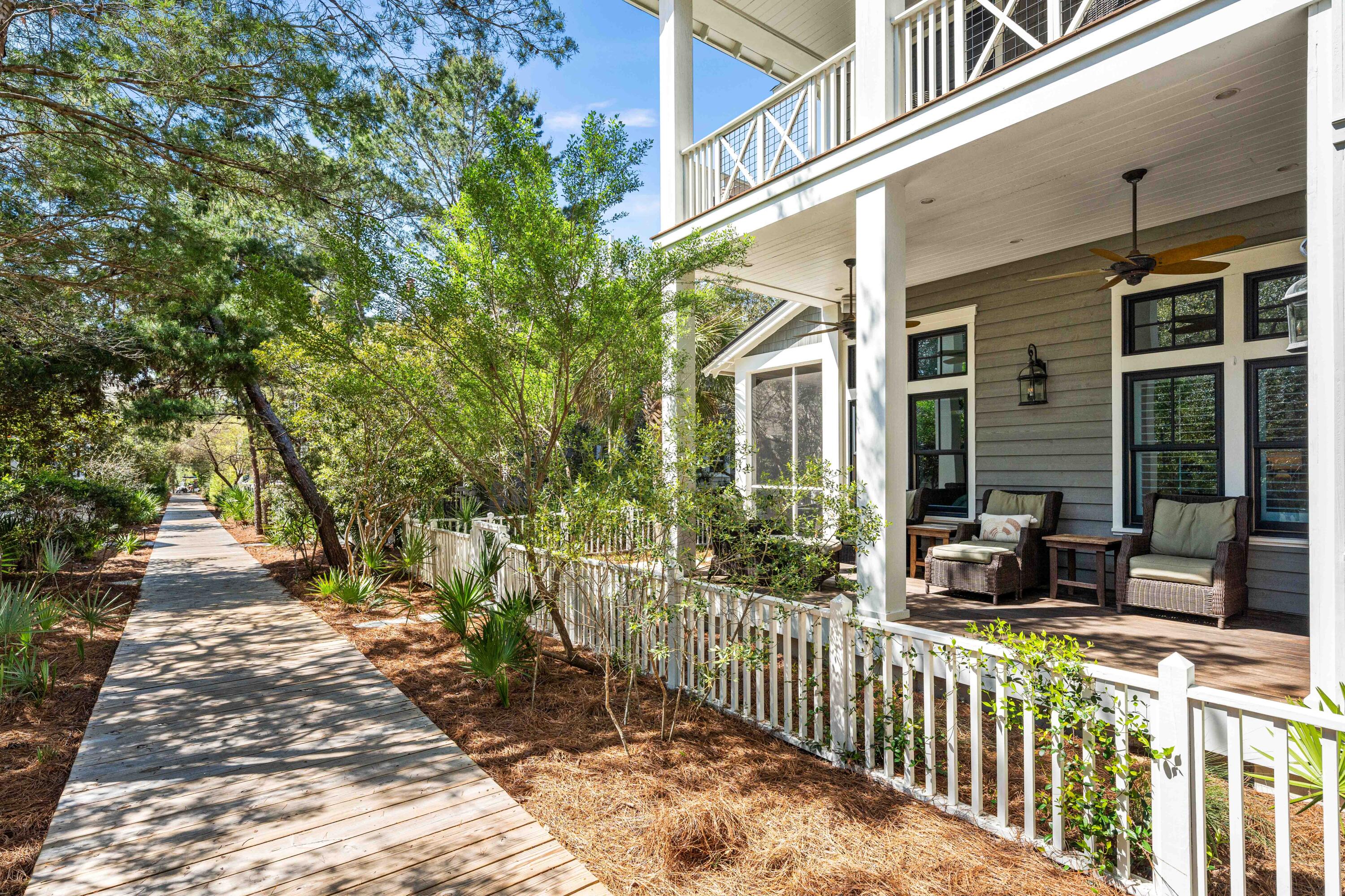 52 North Shingle Way Inlet Beach, FL 32461 - Photo 69 of 77 a view of a house with large windows and a small yard