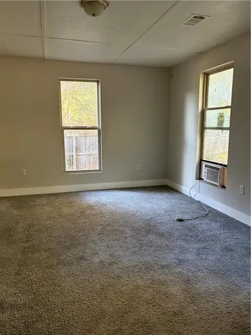 an empty room with windows